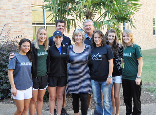 Diane Chenault, Brett’s mother, with members of the Delta State Women’s Cross Country team, (front from left) Hend Alboshaba, Ashley Carrillo, Hannah Grace Whitaker, Diane Chenault, Amanda Cornelison, Maddie Glass, Alyssa Shetley  (back from left) Doug Pinkerton, Coach of the Women’s Cross Country, and Ronnie Mayers, Director of Aquatics and Assistant Athletic Director.